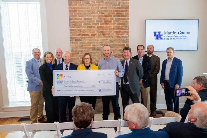 Altria and Philip Morris USA representatives with UK Martin-Gatton CAFE Dean Laura Stephenson, holding a large donation check 