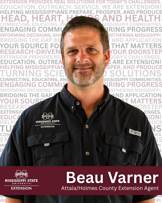 Mississippi State Extension agent Beau Varner wearing a black button-up shirt with embroidered logos and standing against a text-filled background.