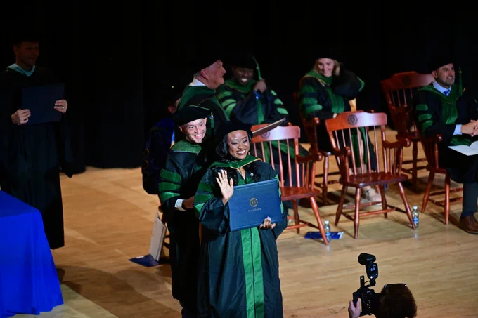 A new graduate from Kent State's College of Podiatric Medicine participates in graduation, Spring, 2026