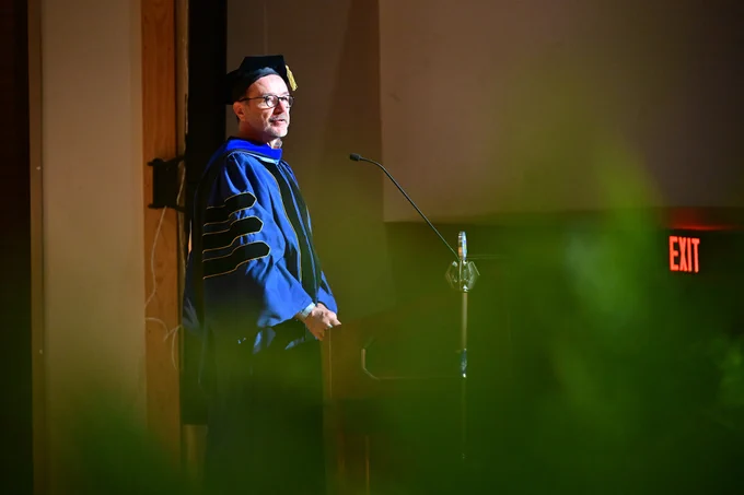 A speaker addresses the new graduates from Kent State's College of Podiatric Medicine Spring, 2026