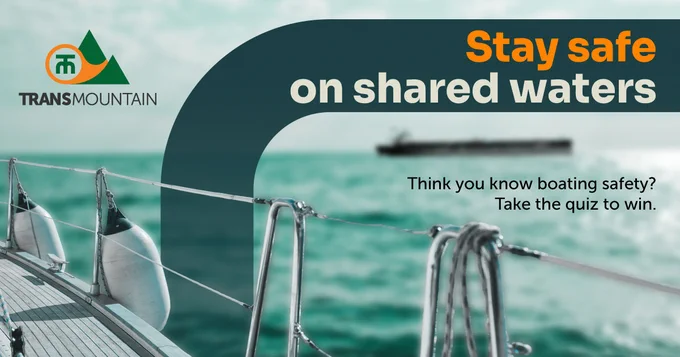 Boat railing in foreground with a distant ship on calm waters, promoting shared water safety awareness.
