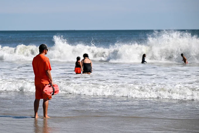 Lifeguard watching people at the beach