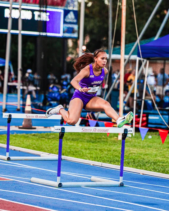 Darian Harris clearing a hurdles during in the 400-meter hurdles prelims.