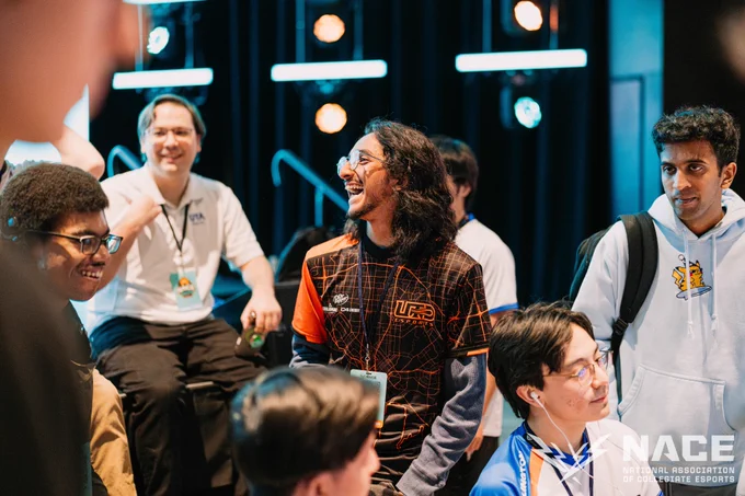 A competitor from UTD laughing in the audience