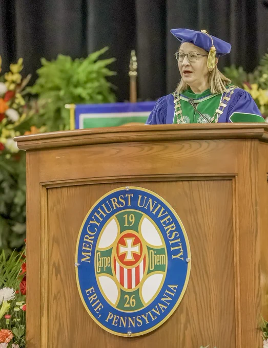 President Getz speaking at a podium
