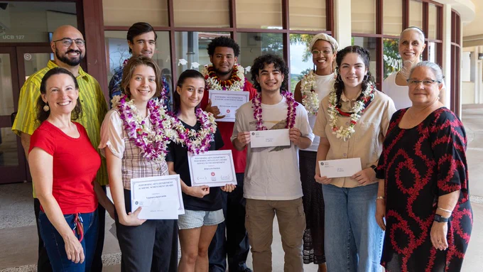 Performing Arts student award recipients and their profs: Front row, from left, Associate Professor Justina Mattos, Valhalla Kalvaitis, Hokulani Thomas, Malachi Oandasan, Cailin Gaume, and Performing Arts Center Manager Lee Barnette-Dombroski. Back row, from left, Assistant Professor Ocean Akaka, Damien Stack, Ronnie Palikū Malone, Tiffany Johnston, and Instructor Kea Kapahua. (Photo: University Relations/UH Hilo)