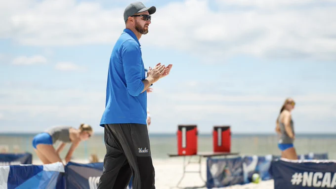Assistant coach Theo Brunner claps
