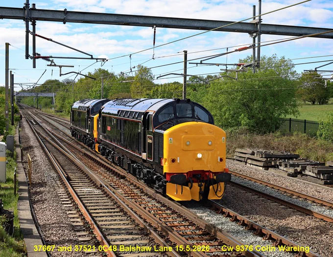 LSL “Locomotive Services Group” diesel locomotive’s no 37667 and 37521 approach Balshaw Lane junction on the West Coast Main Line in Lancashire on 15.5.26.
Both of these class 37’s have recently been repainted into a lined black livery at Arlington Fleet services in Eastleigh in Hampshire. 
The leading locomotive, 37667 carries the name "Flopsie” 
They are making a light engine move from Crewe to Carlisle and here pass Balshaw Lane at 09.55hrs. 
15.5.26
Image Cw 9376 copyright Colin Wareing of Colin and Carole’s Creations
www.colinandcarolescreations.co.uk 
