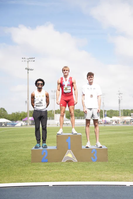 three athletes stand on the podium at the asun championship