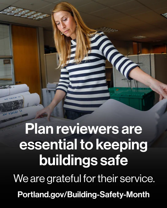 A woman looks down at large building plans and words read “Plan reviewers are essential to keeping buildings safe. We are grateful for their service. Portland.gov/Building-Safety-Month" 
