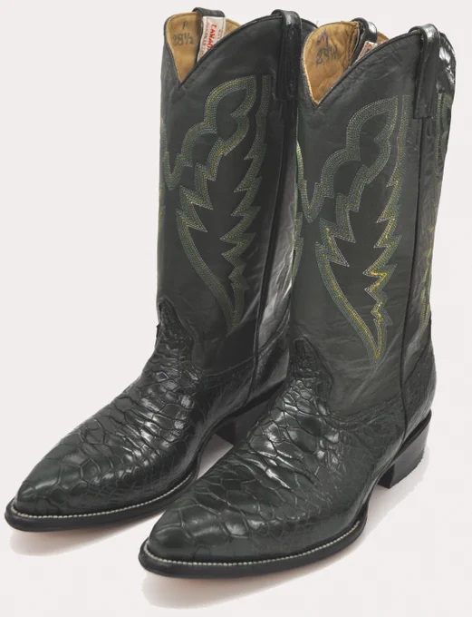 Illegal pair of dark green cowboy boots with intricate stitching and sea turtle leather.
