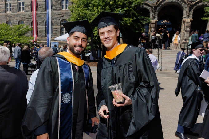 two men in regalia outside