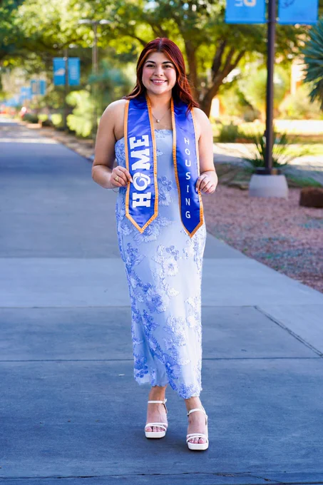 Angelo State University Resident Assistant posing for a graduate photo.