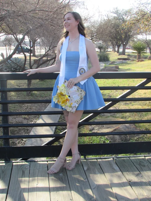 Angelo State University Resident Assistant posing for a graduate photo.