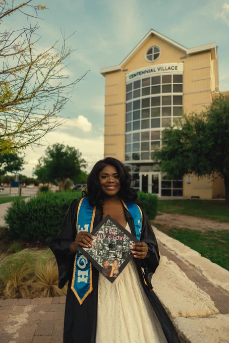 Angelo State University Resident Assistant posing for a graduate photo.