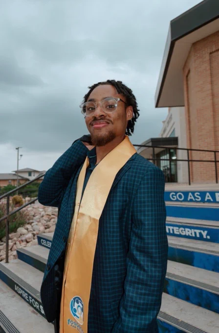 Angelo State University Graduate Hall Director posing for a graduation photo.