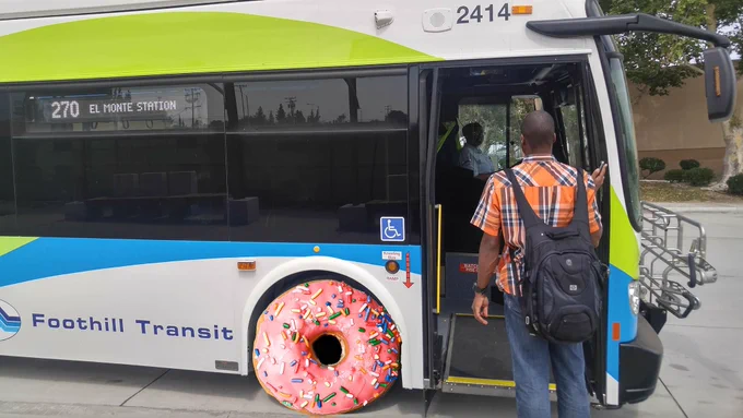 A customer boards a Foothill Transit bus whose front tire has been replaced with a pink-frosted donut with colorful sprinkles.