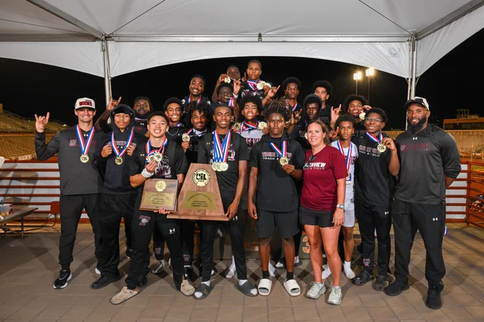 Mansfield Timberview team and coaches pose with championship trophy on awards stand.