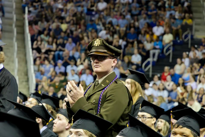 Student posing at Commencement
