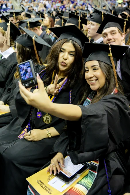 Student posing at Commencement