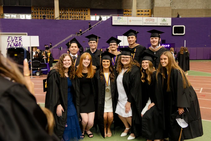 Student posing at Commencement