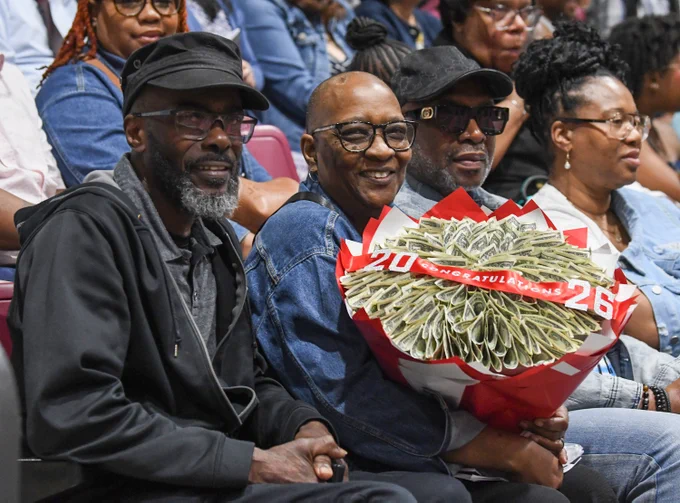 Lawerence Zantt and Gwen Zantt hold a money bouquet for their granddaughter, Mar'Shay Robinson, during the 139th Spring Commencement at the University of Maryland Eastern Shore.