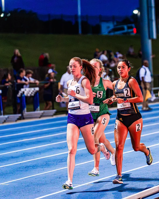 Izzy Greene leading a pack of runners in the steeplechase.