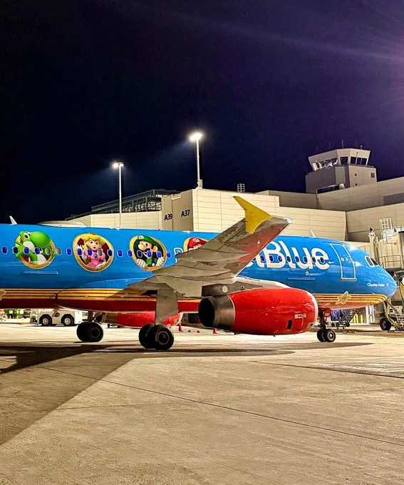 A JetBlue airplane at the gate.