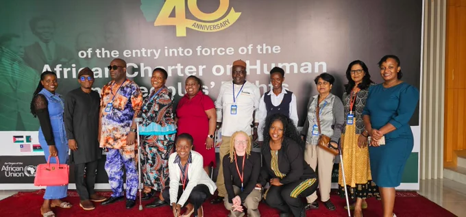 ADF Executive Council member, Ayassou Komivi with OPD delegates from Kenya, Nigeria, Mauritius and Zimbabwe pose for a photo during the 87th session of the African Commission in Banjul