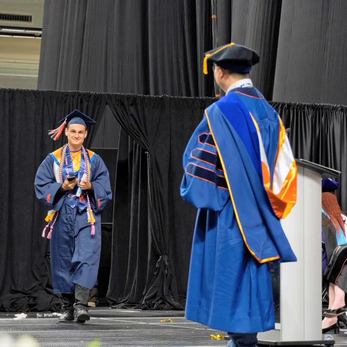 Luke Alvarado walks toward the dean.