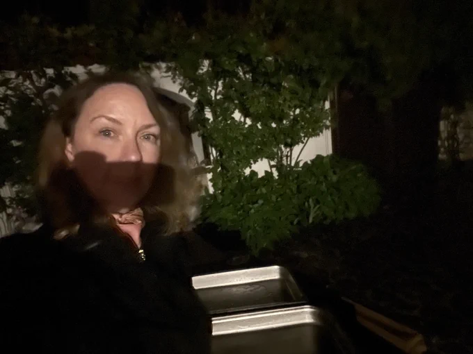 me at night in teh rain by a rain collecting pan