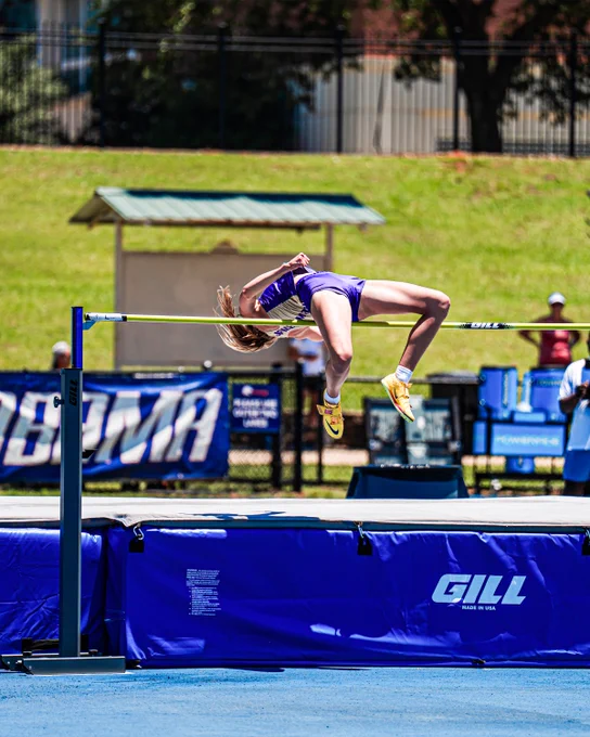Violet Evans clearing the bar in the high jump.