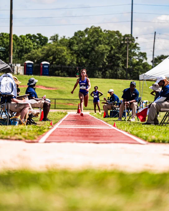 Grace Mimnaugh going down the runway in the triple jump.