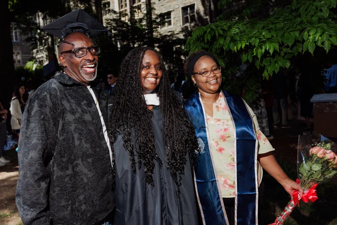 a family smiles after graduation
