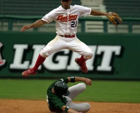After making the double play throw to first Iowa State second baseman Spencer Allen (22) watches the play as Baylor runner Mike Huggins (8) slides under him to end the fifth inning at the Big 12 tournament in Oklahoma City Thursday, May 17, 2001. Iowa State won 6-5. AP Photo/J. Pat Carter
