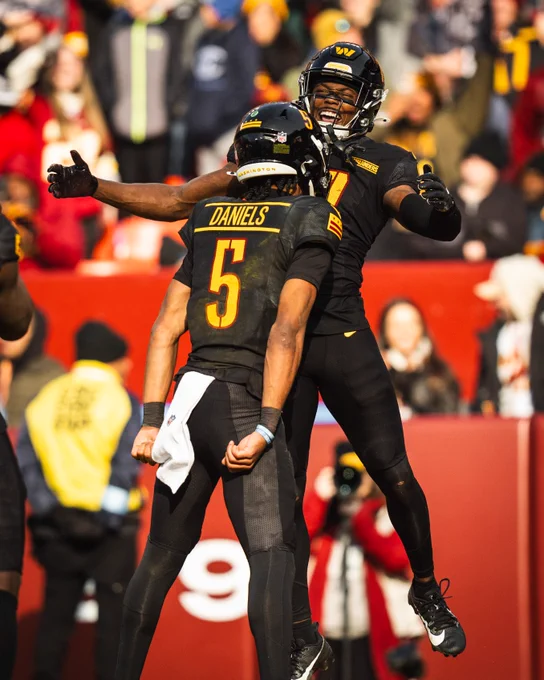 Photo of Jayden Daniels and Terry McLaurin celebrating after a play.