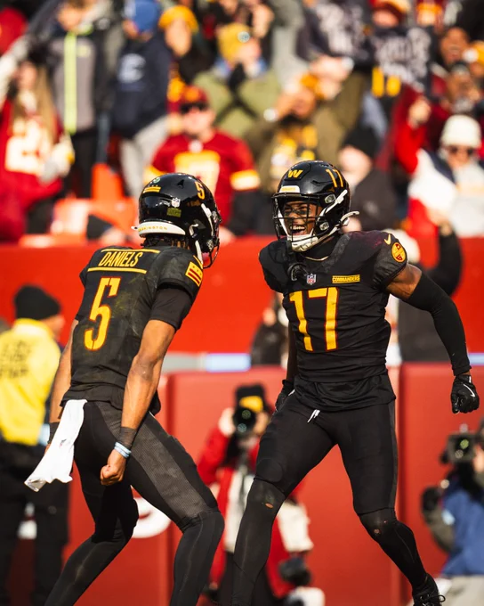 Photo of Jayden Daniels and Terry McLaurin celebrating after a play.