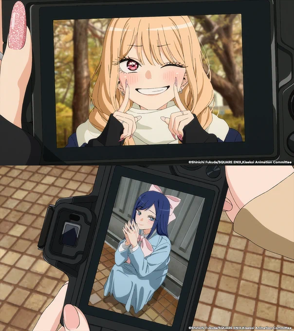 Two images from My Dress-Up Darling Season 2. The top image features a camera with a photo of Marin smiling on the screen. The top image features a camera with a photo on the screen of Amane dressed in cosplay, crouched down, with a small smile.