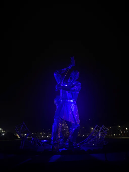 Image of the Shipbuilders in Port Glasgow lit up blue. 