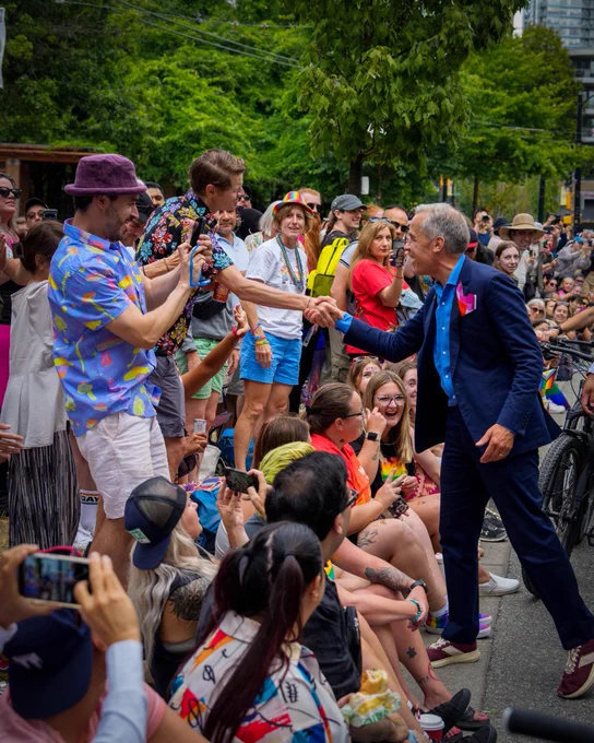 Prime Minister Carney marches in the Vancouver Pride parade in Vancouver, British Columbia.
