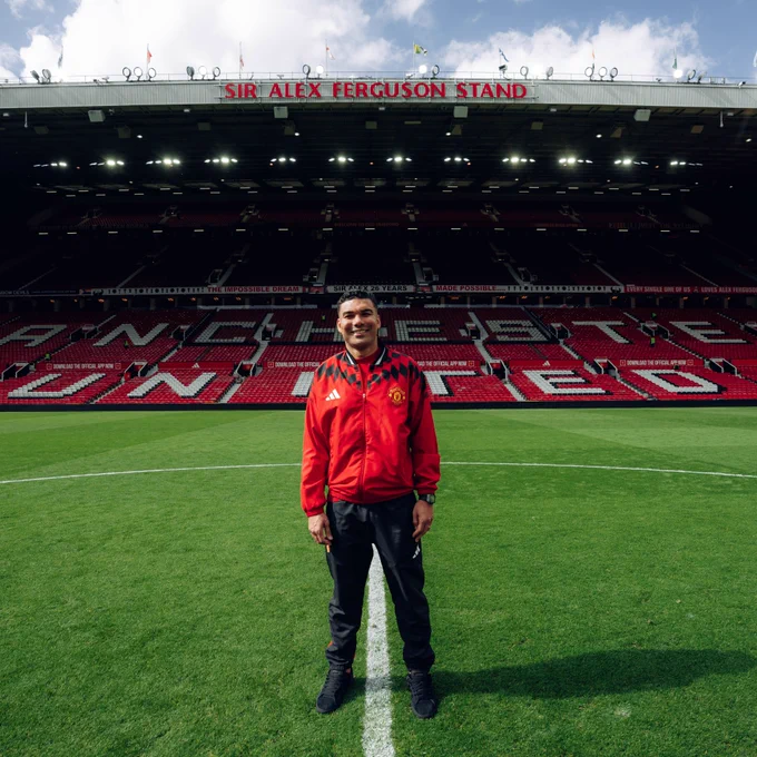 Casemiro has his photo taken in front of an empty Sir Alex Ferguson Stand after today's game.