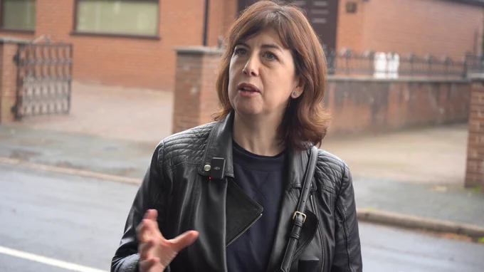 Lucy speaking to members 