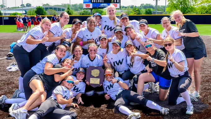 Iowa Western Softball celebrates with the Midwest District Trophy at the Dr. John & Jean Marshall Complex in Council Bluffs, IA