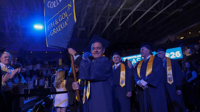 The Golden Graduates walk into Commencement at Merrimack College.