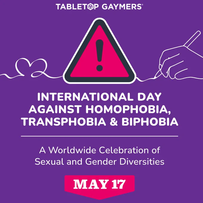 top center appears tabletop gaymers text logo. Line art of a hand holding a pen and drawing a heart. At the center, the text reads “IDAHOBIT – International Day Against Homophobia, Biphobia and TransphobiaA Worldwide Celebration of Sexual and Gender Diversities – may17.org” and a pink triangle with an exclamation mark, which is the logomark of IDAHOBIT.