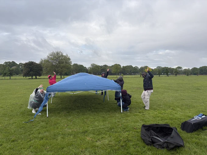 Volunteers putting up tent