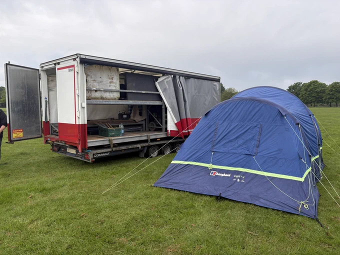 Volunteers prepare arriving tents