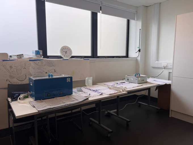 Image shows classroom set up with a splinting bath visible on a table. 