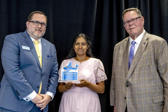 Professor Shantha Sriram from STEM receives an Excellence Award from RSC President Travis Hurst and RSC Board of Regents Chair Bill Croak.