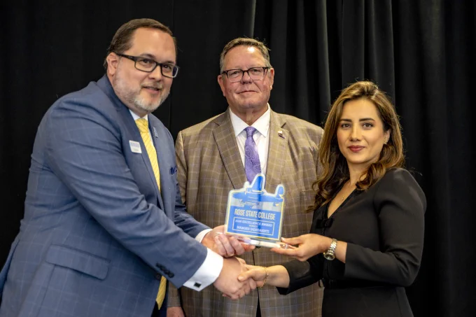 Professor Narges Dehdashti from STEM receives an Excellence Award from RSC President Travis Hurst and RSC Board of Regents Chair Bill Croak.
 